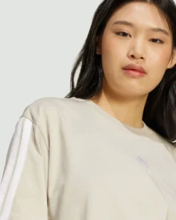 ADIDAS - T-SHIRT DONNA MEZZA MANICA  BEIGE CON 3 BANDE BIANCHE  ESSENTIALS 3-STRIPES - JE1219