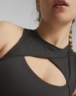 PUMA - Top nero in tessuto traspirante con logo oro
