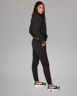 PUMA - TUTA COMPLETA NERA ESSENTIAL+ GLITTER FZ SUIT FL DA DONNA , 684764-01